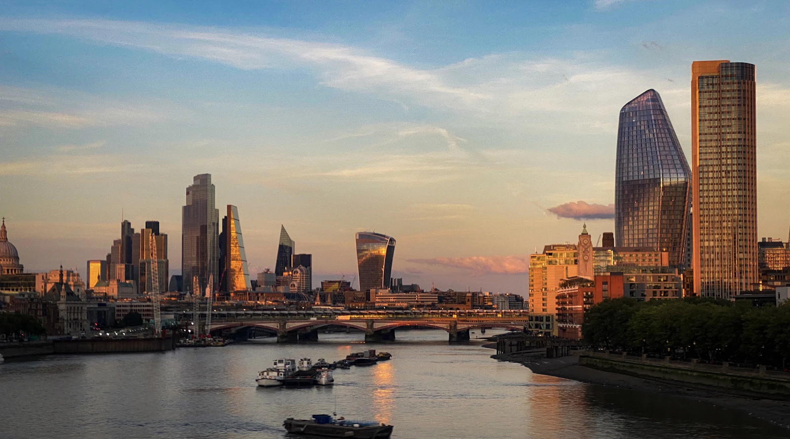 London skyline across the Thames in golden morning light
